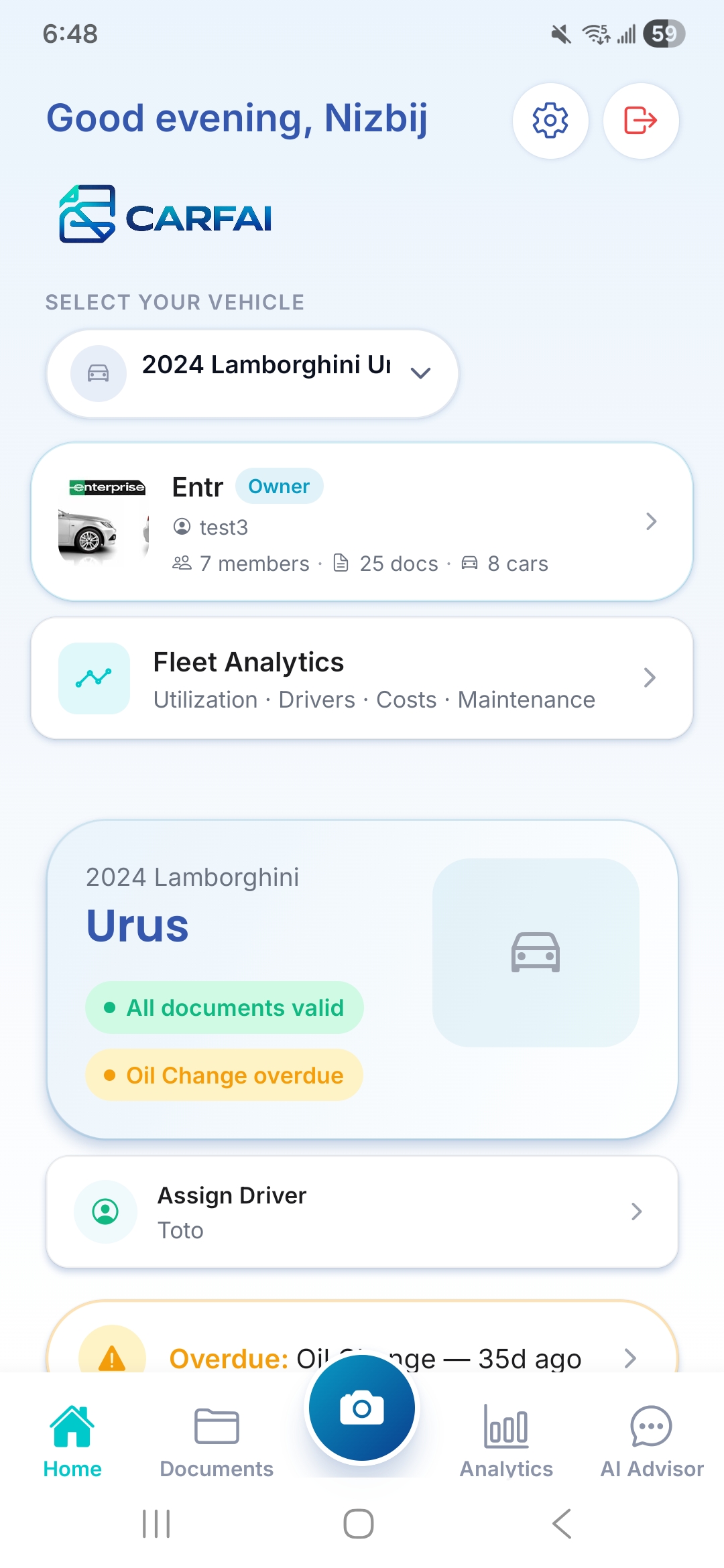 B2B home screen for the Entr organization showing fleet analytics, a 2024 Lamborghini Urus with an oil-change-overdue flag, and driver assignment.